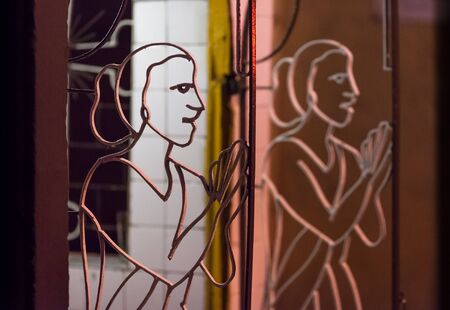 The woman's silhouette who has put hands in a prayer, executed from metal rods.の写真素材