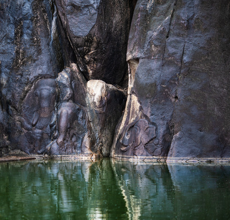 The ancient images of elephants which are carved on huge stone boulders at the temple of Isurumuniya in the neighborhood of Anuradhapura, the old capital of Sri Lanka.の写真素材