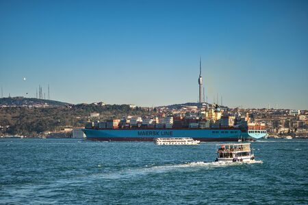 A huge container ship, Maersk Line, passes through the Bosphorus in front of the Asian side of...