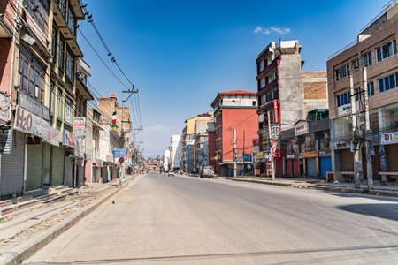 March 31, 2020. Kathmandu, Nepal. Boudha District. Empty street from people and quarantined shops on a sunny day.のeditorial素材