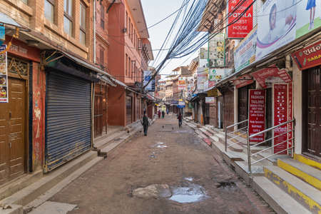 March 25, 2020. Kathmandu, Nepal. The area of â€‹â€‹Stupa Bouda. A deserted street with...