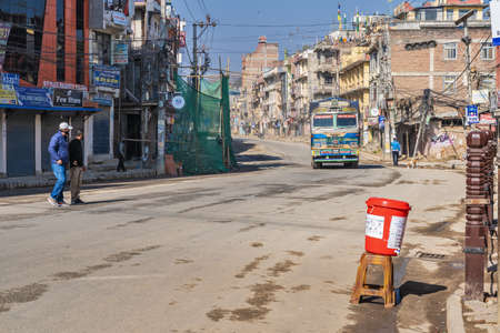 March 25, 2020. Kathmandu, Nepal. The ââBouda area. Against the background of an empty deserted street and quarantined shops, moving truck carrying water.のeditorial素材