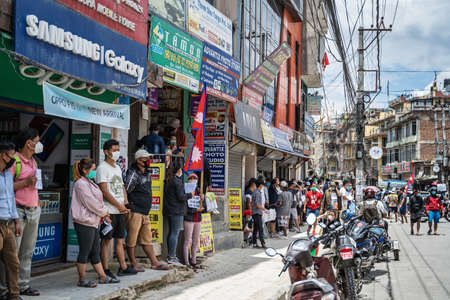 June 14, 2020, Kathmandu, Nepal. The people in medical masks, with nepali flags and anti-government...