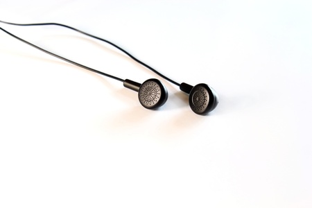 Black earphones on whiteの写真素材
