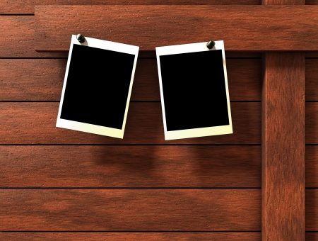 Two empty pictures on wood backgroundの写真素材