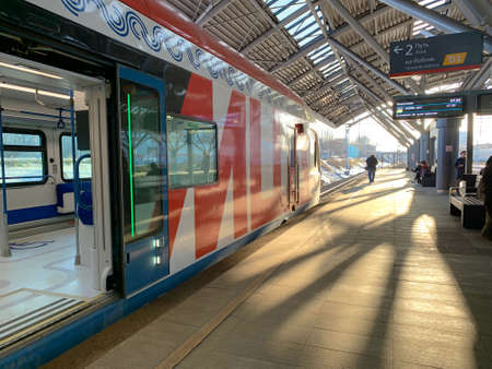 The train stands at the station on a sunny dayの写真素材