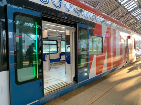 The train stands at the station on a sunny dayの写真素材