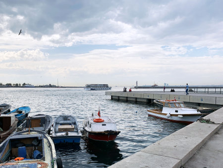 Ships and boats sail the blue seaの写真素材