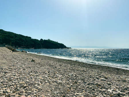 Stone coast of the blue sea with wavesの写真素材