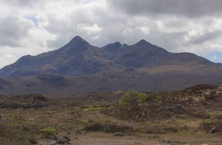 The Isle of Skye, connected to Scotland's north-west coast by a bridge, is characterised by its rugged landscape. This photo shows panoramic view on the mystic landscape.の写真素材