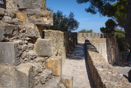 Battlements of the medieval castle of Sao Jorge in Portugal's capital Lisbonの写真素材