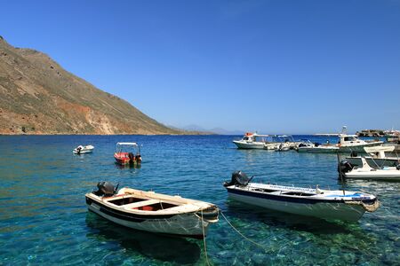 clear water bay of Loutro town on Crete island in Greeceの写真素材