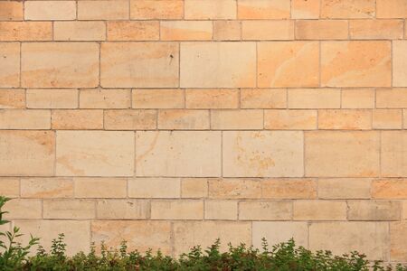 A Vintage grunge sandstone blocks wall texture.
