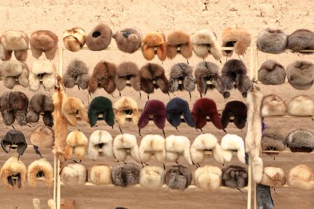 Sale of fur caps in a market in uzbekistanの写真素材