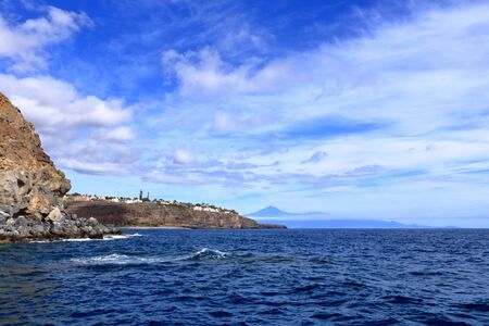 Rocky cliffs on the shore on the coast of La Gomera Island, Canary Islands, Spainの写真素材