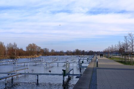 Boat Dock and Basin Marina Empty Awaiting Boating and Shipping Season on Water, Lake and River in Werder/Havel, Brandenburg, Germany, Europeの写真素材