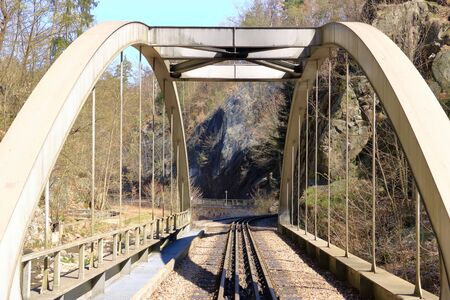 A Small old rusty steel train trestle bridgeの写真素材
