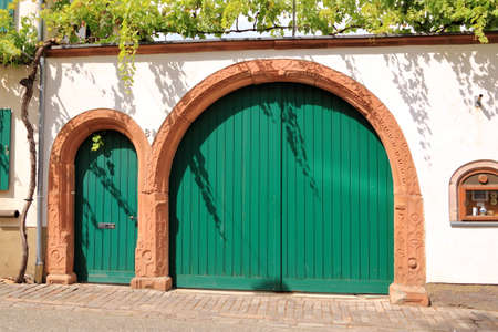a large wooden door in an old country house