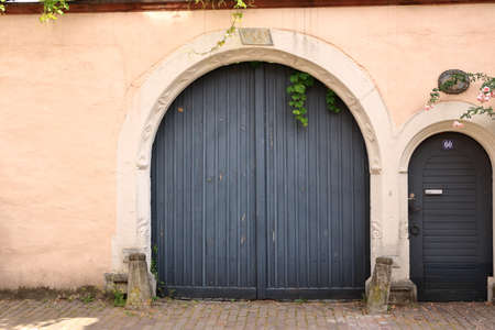 a large wooden door in an old country houseの写真素材