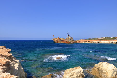Shipwreck of the abandoned ship Edro III on the rocky coast at Akrotiri Beach in Cyprusの写真素材