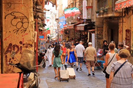 July 11 2021 Napoli in Italy in Europe: Big souvenir and statues colorful market on Via San Gregorio Armeno full of tourists in Naplesのeditorial素材