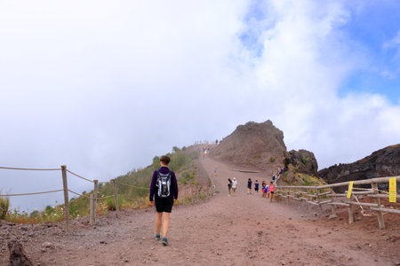 July 16 2021 - Naples, Italy: People walk along the footpath around the Vesuvius crater, Naples in Italyのeditorial素材