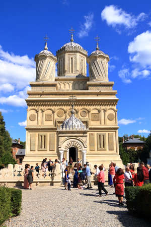 September 4 2021 - Curtea de Arges in Romania: View of the Arges Monastery with numerous visitorsのeditorial素材