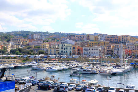 July 12 2021 - Pozzuoli, Italy: View of the typical residential buildings in center of Pozzuoli city in southern Italy from boatのeditorial素材