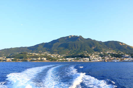 View to the Coastal landscape of Lacco Ameno from the sea, Mediterranean Sea coast, bay of Naples, Ischia island in Italyの写真素材