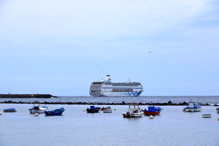 November 25 2021 - Santa Cruz, Tenerife, Spain: Cruise ship AIDAmira anchored near coast of Tenerife during the covid 19 pandemicのeditorial素材