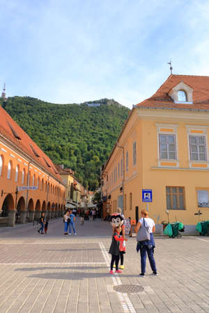 September 11 2021 - Brasov, Brasov in Romania, Transylvania: Tourists on ancient street of the medieval cityのeditorial素材