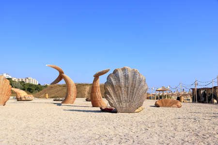 art made of straw at beach with tourists in summer in Constanta, Romania