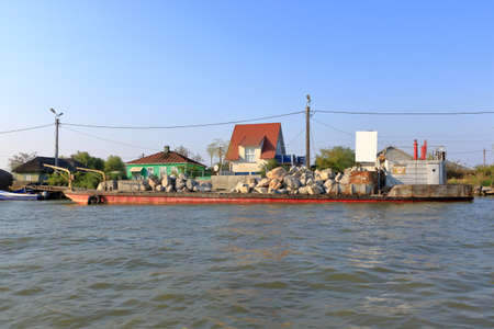September 13 2021 - Sulina in Romania: Buildings on the shore of Danube Riverのeditorial素材