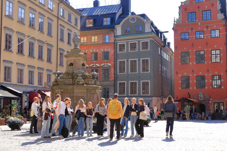 May 24 2022 - Stockholm in Sweden: Tourists walking on cobble streets in Riddarholmen is part of Gamla stan is old town of the city, Swedenのeditorial素材