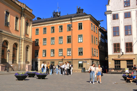 May 24 2022 - Stockholm in Sweden: Tourists walking on cobble streets in Riddarholmen is part of Gamla stan is old town of the city, Swedenのeditorial素材
