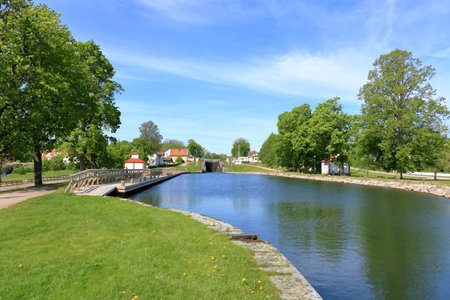 May 24 2022 - Linkoping, Berg in Sweden: lock of a ship in the lock station towards Lake Roxenのeditorial素材