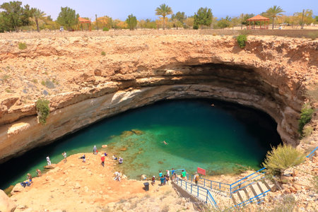 March 22 2022 - Bimmah sinkhole, Oman: People enjoy one of the world most beautiful natural sinkhole in the Sultanate Omanのeditorial素材