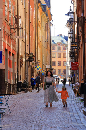 May 24 2022 - Stockholm in Sweden: Tourists walking on cobble streets in Riddarholmen is part of Gamla stan is old town of the city, Swedenのeditorial素材