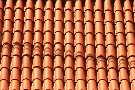 View of old Roof shingles background and texture. Orange wall background. Unique tiles. Roof top.の写真素材