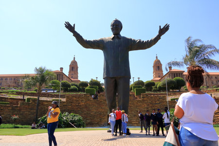 September 29 2022 - Pretoria in South Africa: People around the Nelson Mandela statue on his square in front of Union Buildings in Pretoria, South Africaのeditorial素材