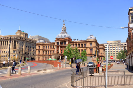 September 29 2022 - Pretoria in South Africa: Church Square, People during the day, walking or resting on the grass in the center of the Cityのeditorial素材