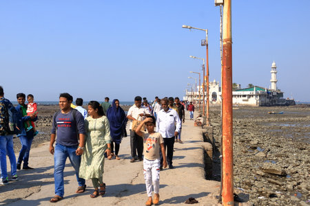 December 20 2022 - Mumbai, Maharashtra in India: Unidentified pilgrims at Haji Ali Dargah, a historical landmark and one of the most prestigious Islamic symbols situated in South Mumbaiのeditorial素材