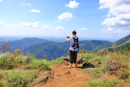 December 27 2022 - Kannur, Kerala in India: People enjoy hiking at the southern tip of the mighty western ghats, Paithalmalaのeditorial素材
