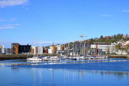 May 28 2022 - Tromso in Norway: picturesque harbor at Tromso in far northern Norway in summer, with colorful boatsのeditorial素材