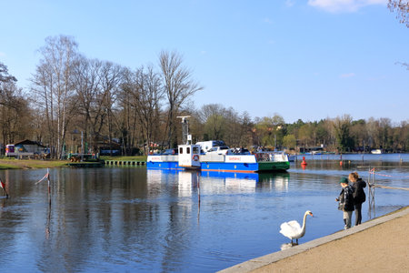 April 5 2023 - Caputh, Brandenburg in Germany: The cable ferry called Tussy 2 for cars and people connects Caputh and Geltow on the Havel waterwayのeditorial素材