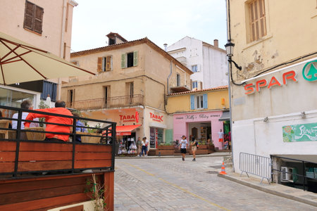 June 02 2023 - Calvi, Corsica in France: Street with historic houses in Calvi old townのeditorial素材
