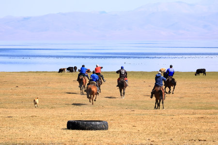 August 24 2023 - Song kol Lake in Kyrgyzstan: Locals play kok boru (ulak tartysh), traditional horse game, with leather dummy instead of a goat carcassのeditorial素材