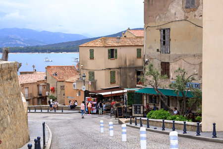 June 02 2023 - Calvi, Corsica in France: Street with historic houses in Calvi old townのeditorial素材