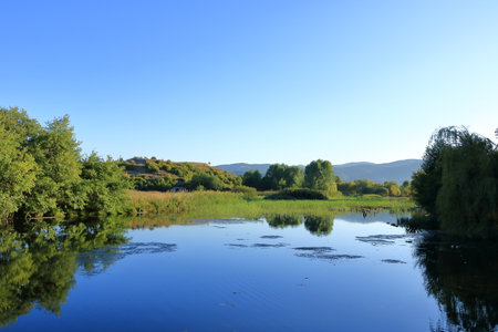 small lake in a park in Tushemisht near Pogradec at lake ohrid in Albaniaの写真素材