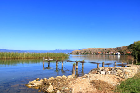 Beautiful lakeshore landscape at lake ohrid (near Lin village) in Albaniaの写真素材
